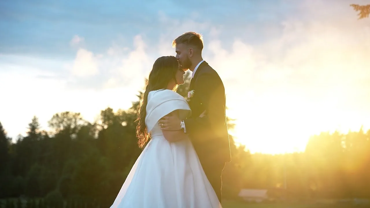 Couple embracing in golden sunset light